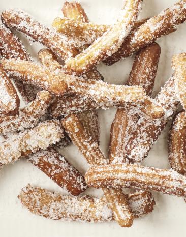 Churros frittiert mit Zucker und Schokosauce